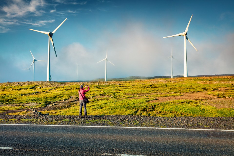 tourist-takes-a-picture-of-wind-turbines-in-the-mo-2025-10-06-14-57-31-utc